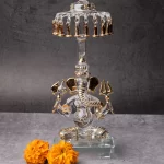 GlassWorld Glass Handicraft statue of Lord Ganesh sitting below Umbrella - 10 inches height with Gold plating